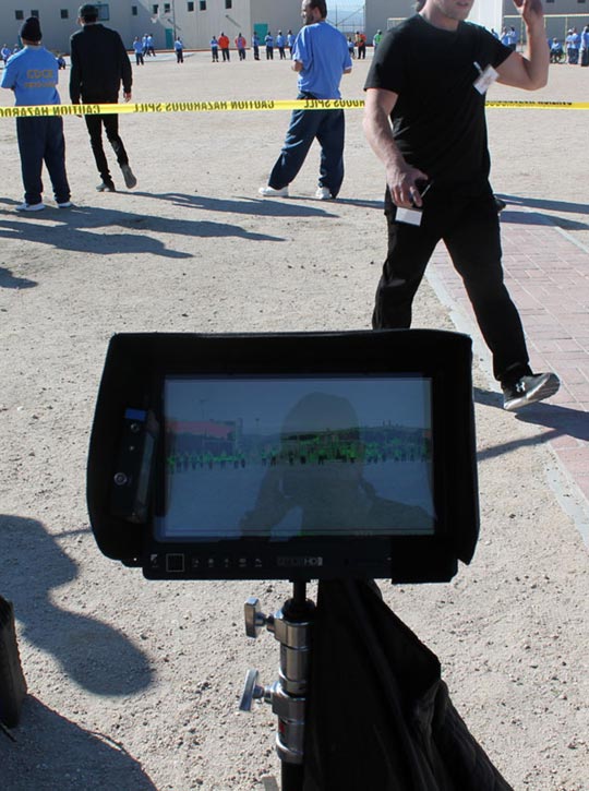 Camera screen showing a group of people standing in a circle