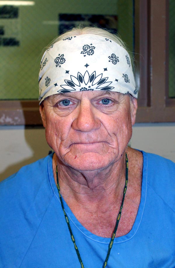 Portrait of an elderly incarcerated man wearing white bandana