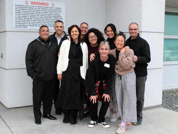 Group photo of Compassion Prison Project staff and volunteers standing outside